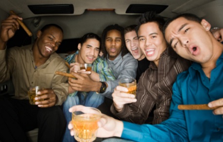 Guys having fun in a limousine during bachelor party